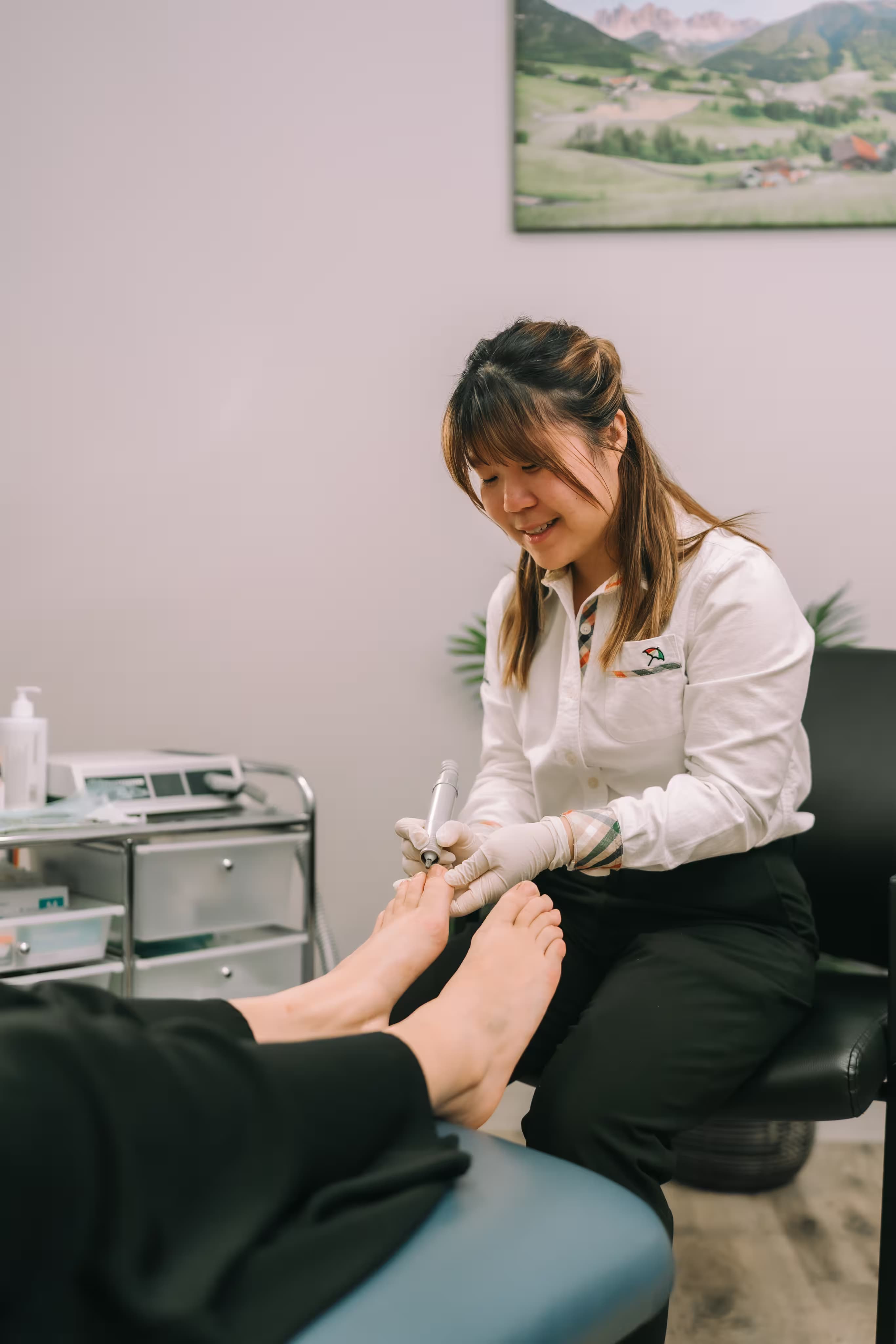 Podiatrist treating a patient's foot