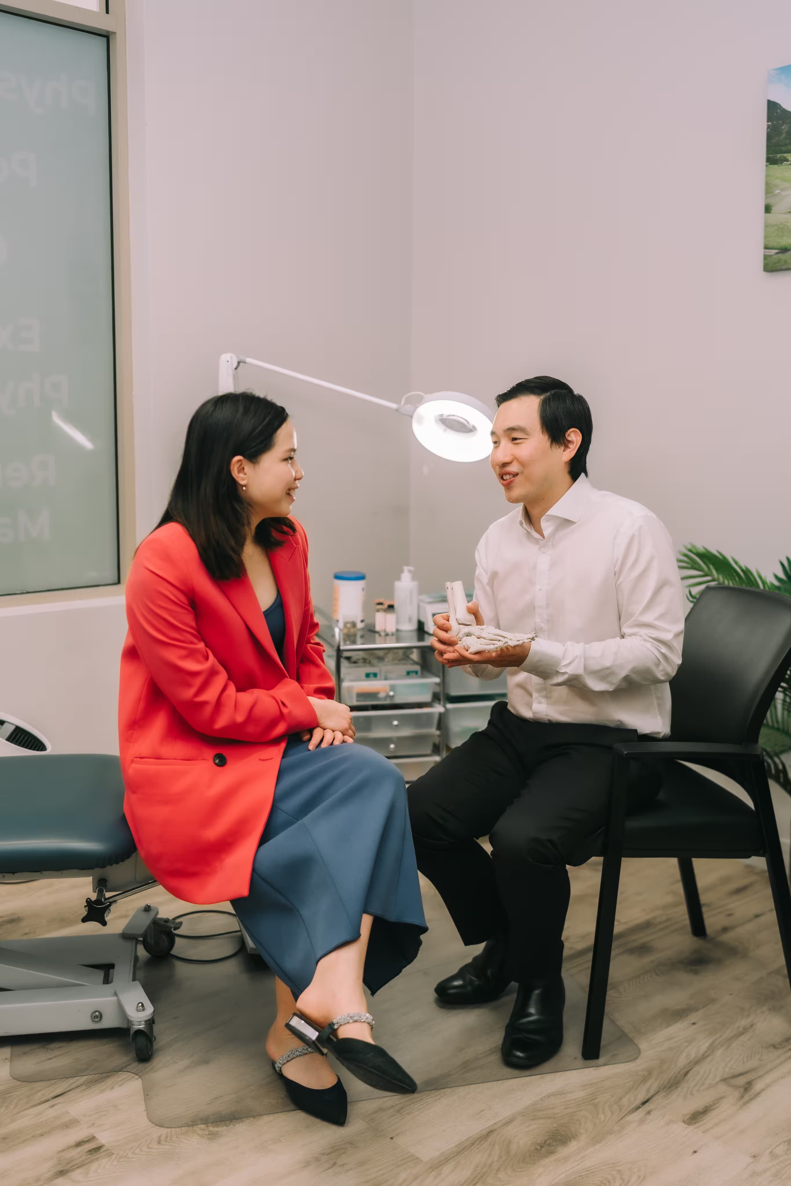 Podiatrist consulting with a patient